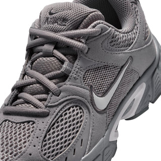 Close-up of youth dark gray sneaker upper with laces, mesh, and molded overlay details