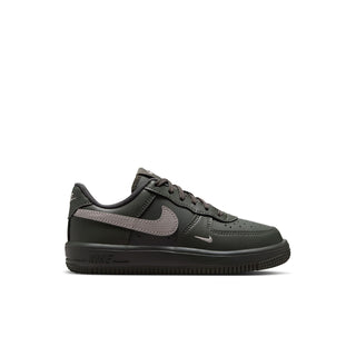 Kids low-top lace-up sneaker in dark green with gray swoosh and perforations