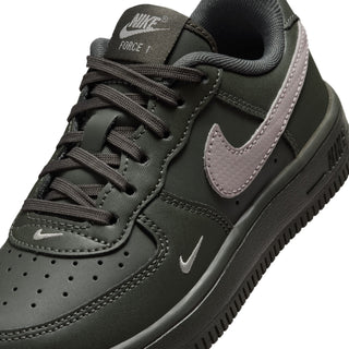 Nike kids low-top lace-up sneaker close-up, dark green with gray swoosh