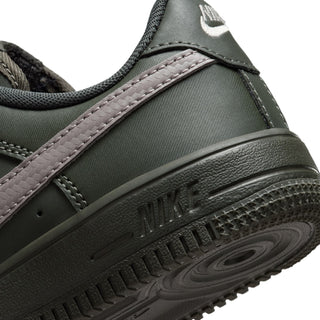 Nike low-top lace-up sneaker midsole and outsole close-up in dark green