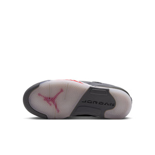 Sole view of youth low-top sneakers with 'JORDAN' branding and red star graphic