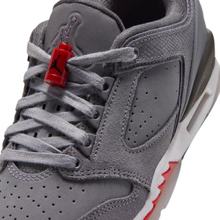 Close-up of youth low-top sneaker laces and tongue loop in cool gray with red