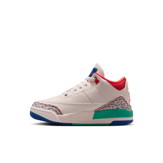 Kids retro sneakers angled side view, off-white with red tongue and blue-green sole