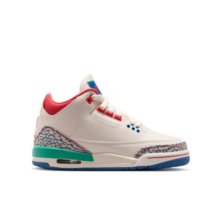 Youth sneakers with white leather uppers, red lining, blue laces, and teal heel trim