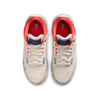 Youth sneaker pair front view with white laces, red interior, and patterned side panels