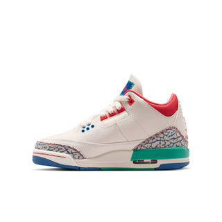 Youth sneakers side profile with white leather, red collar, patterned toe panel, teal sole