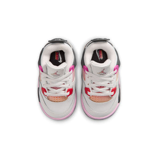 Toddler sneakers pair showing white laces, pink trim, and padded collar lining