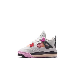 Toddler white lace-up sneaker with purple sole, red lace loops, and gray side panel