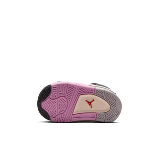 Toddler shoe outsole view with purple tread and beige center panel