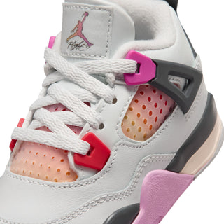 Toddler sneaker close-up: white laces, orange perforations, red accents, and pink heel pull