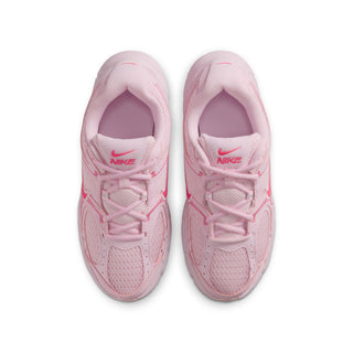 Pair of youth light pink sneakers with lace-up closure and Nike logo on tongue