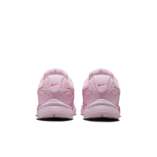 Youth light pink sneakers with rear tread detail and padded collar