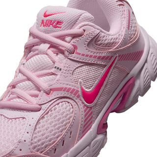 Close-up of youth light pink sneaker upper with mesh texture and pink laces