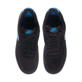 Black low-top sneakers with blue lining and NIKE logo on tongues