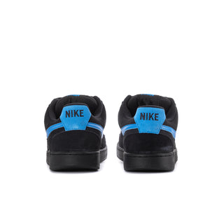 Black low-top sneakers with blue heel tab and NIKE on the back