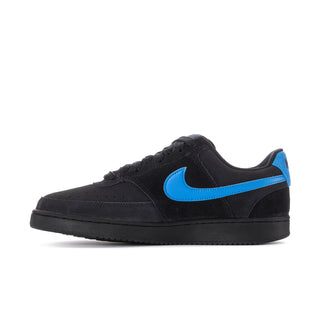 Black low-top sneaker with blue Swoosh stripe and textured toe area