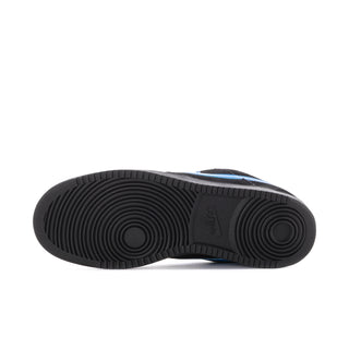 Black rubber outsole underside with circular tread pattern for low-top sneaker