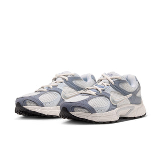 Pair of Nike V5 RNR women's sneakers with mesh uppers, gray overlays and chunky soles