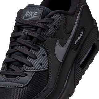 Close-up of men's Nike Air Max 90 PRM sneaker, black laces and grey swoosh panel