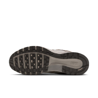 Men's shoe outsole view with grippy tread and Nike logo on the midfoot