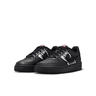 Pair of kids' black Air Force 1 low-top sneakers with white wolf graphics