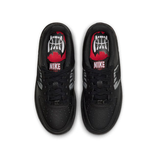Kids' black Air Force 1 sneakers with matching black laces and wolf lining on tongue