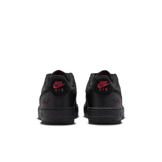Kids' black Air Force 1 sneakers with rear “AIR” tag and red heel details