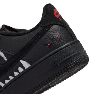 Kids' black Air Force 1 low-top sneaker with red accents and white wolf details
