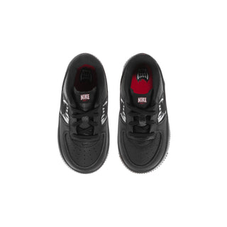 Kids' black sneakers, front view with lace-up closure and NIKE branding inside