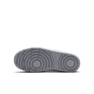 Youth low-top sneaker outsole in light gray with circular traction pattern
