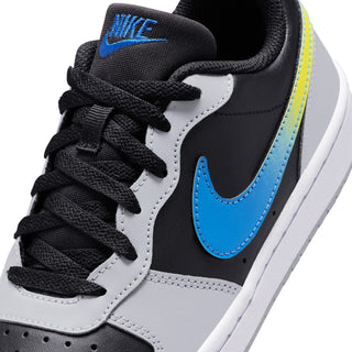 Close-up youth low-top sneakers upper: black laces, blue swoosh, white and gray panels