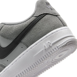 Youth Air Force 1 midsole close-up, smoke gray suede with Air text on white outsole