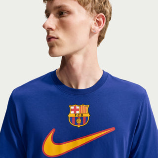 Deep royal blue FC Barcelona T-shirt close-up with Nike swoosh and club crest