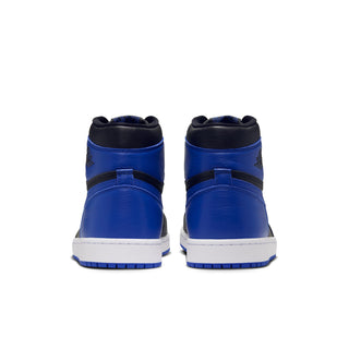 Back view of black and royal blue high-top sneakers with white midsole