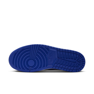 Blue rubber outsole of black and royal blue high-top sneakers with tread pattern