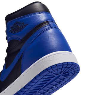 Side close-up of royal blue and black high-top sneaker with white sole