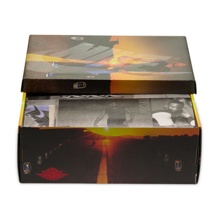 Shoe box packaging with colorful abstract lid graphics and brand icons