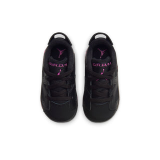 Black toddler low-top sneakers with pink Jumpman logo on tongue and heel
