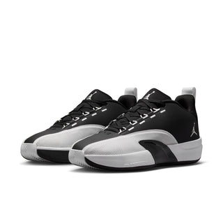 Men's black and white low-top athletic sneakers, front view with lace-up design