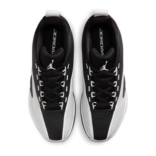 Men's black and white sneakers with lace-up front and white-trimmed tongue