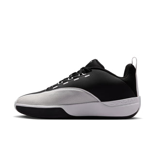 Men's black and white low-top sneakers with lace-up front and textured side panel