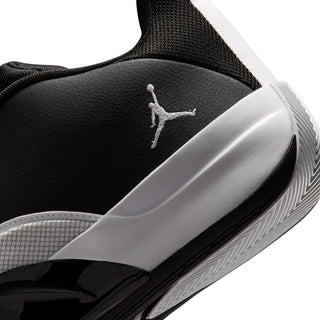 Men's black sneaker side with white logo and black-and-gray sole