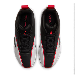 Men's black sneakers, top view of tongue and laces with red pull tabs
