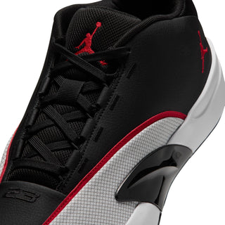 Men's black sneaker upper close-up with red trim, laces, and Jordan logo
