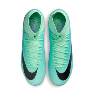 Pair of men's soccer cleats, mint green uppers with black swoosh, front view