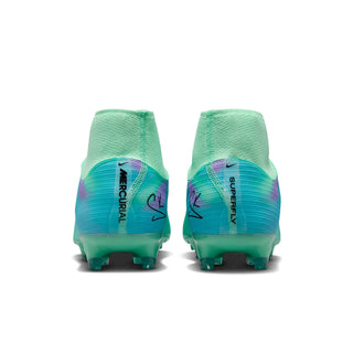 Men's soccer cleats, rear view: mint and teal with purple accents and stud sole