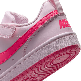 Kids sneaker heel close-up with light pink upper, magenta Swoosh, and pink outsole