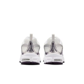 Youth white sneakers from the heel with rear NIKE branding and purple-tinted cushioning tabs