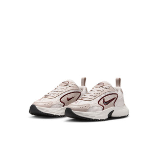 Pair of kids running shoes, light cream uppers with burgundy swoosh and black details