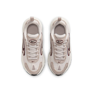 Kids running shoes showing lace-up front and padded collar in light cream